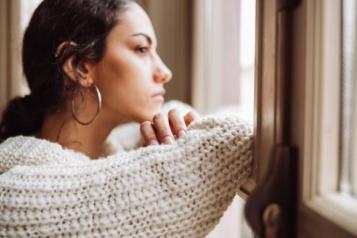 Lady looking out of window