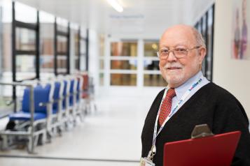 man at a conference with clip board